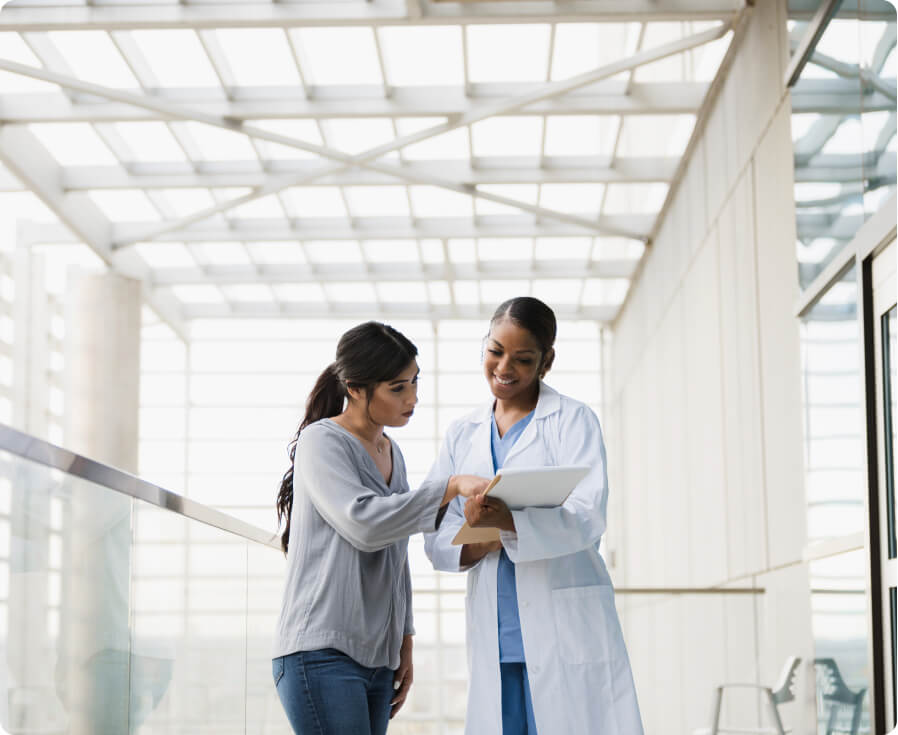 Shifts two women looking at a chart